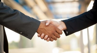 businessman and businesswoman shaking hands